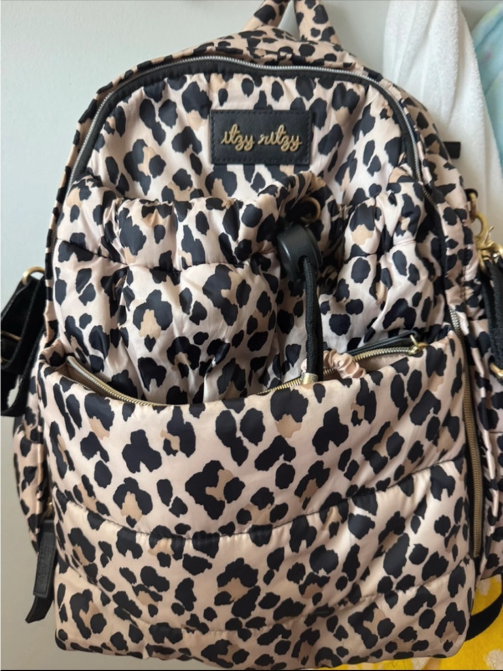 Itzy Ritzy Quilted Leopard-Print Backpack in Beige and Black